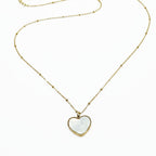 Heart-shaped pendant necklace on a white background